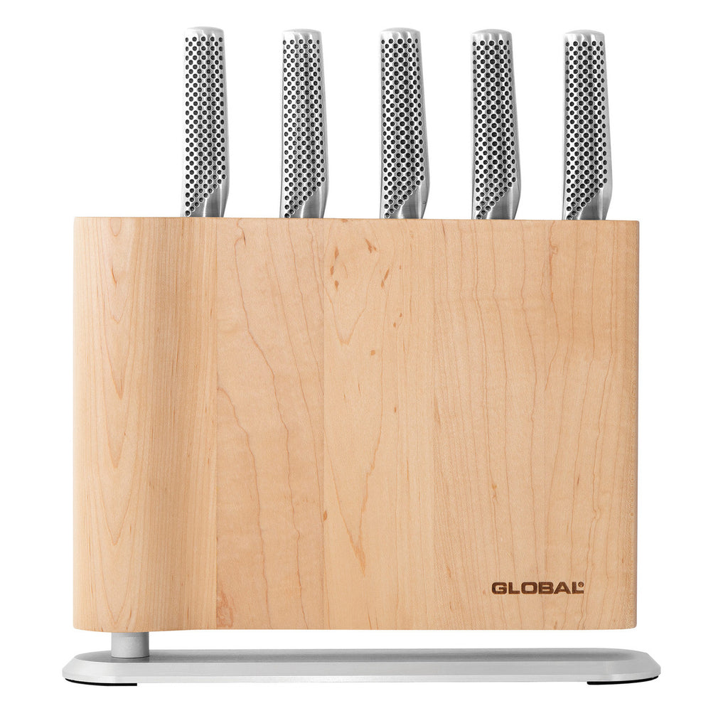 Set of knives in a wooden block with 'Global' branding on a white background
