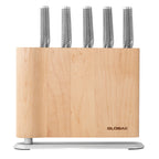 Set of knives in a wooden block with 'Global' branding on a white background
