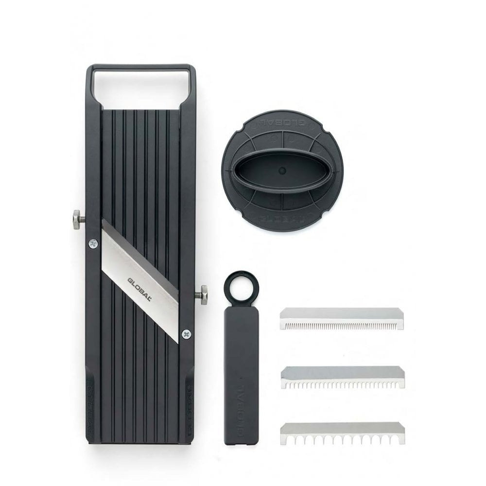 Set of grooming tools including a black and silver device, bowl, and combs on a white background